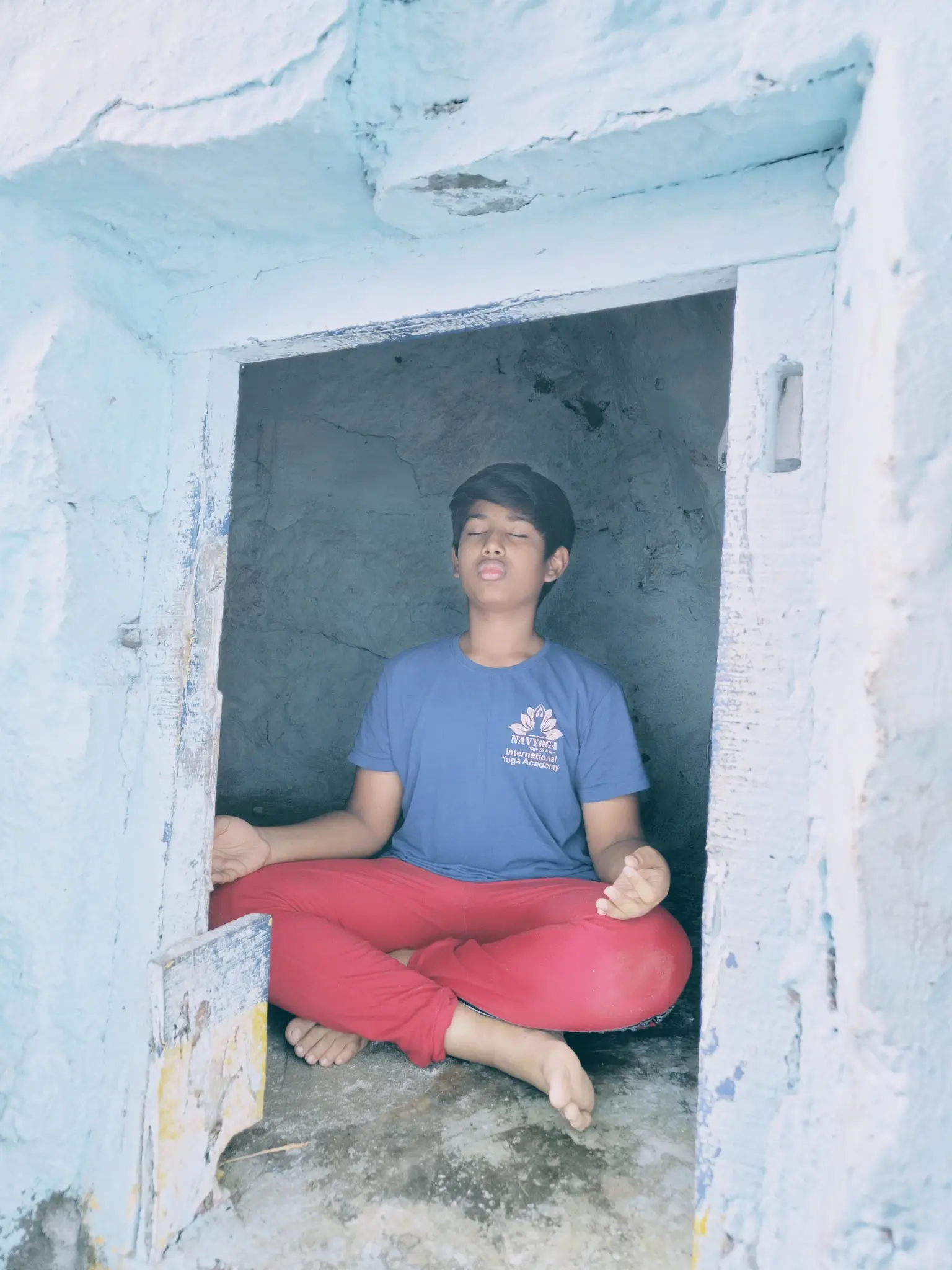 Naveen K. Kolli practising pranayama by a lake