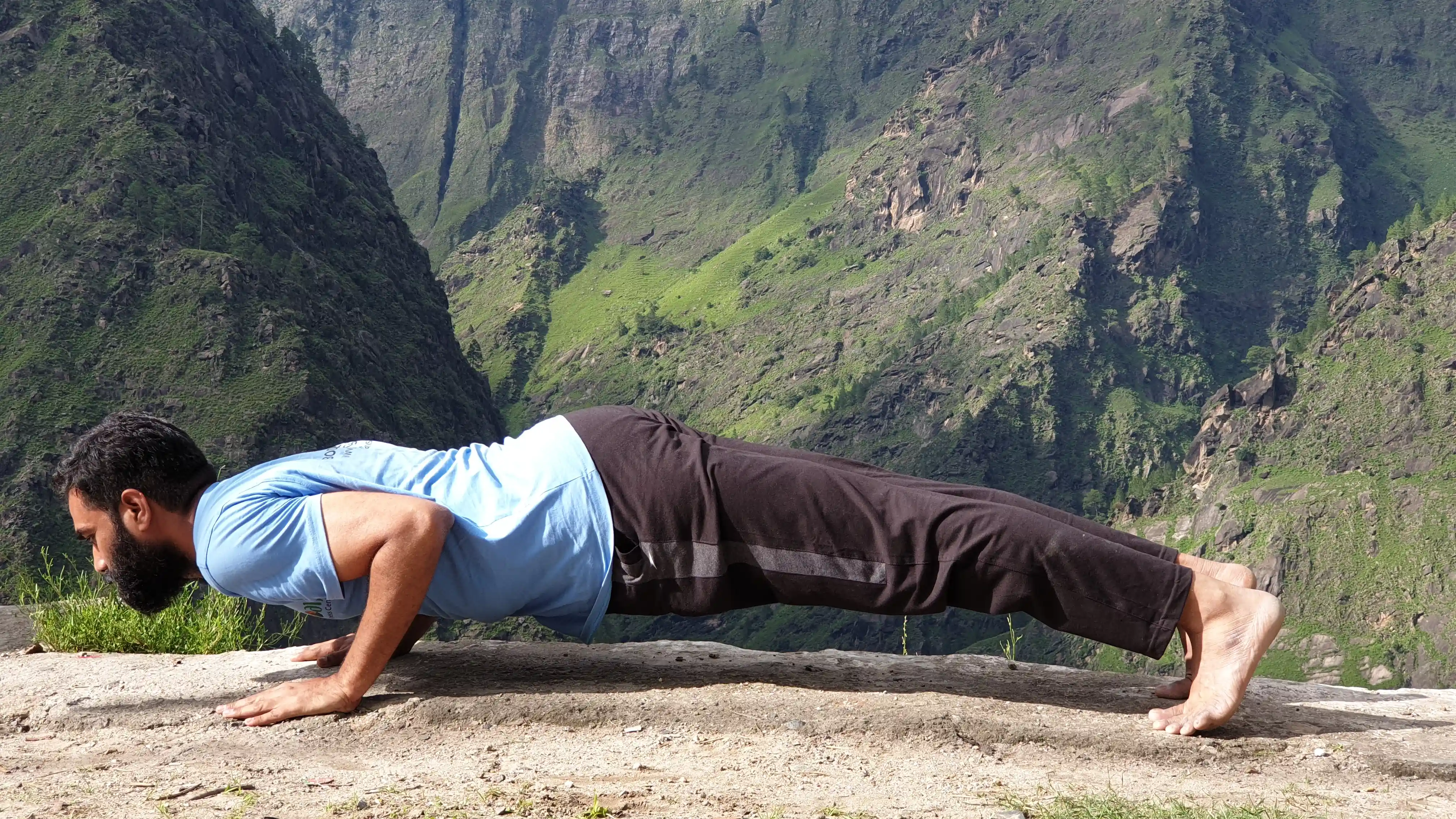 Naveen K. Kolli in Chaturanga on a Himalayan mountain ledge