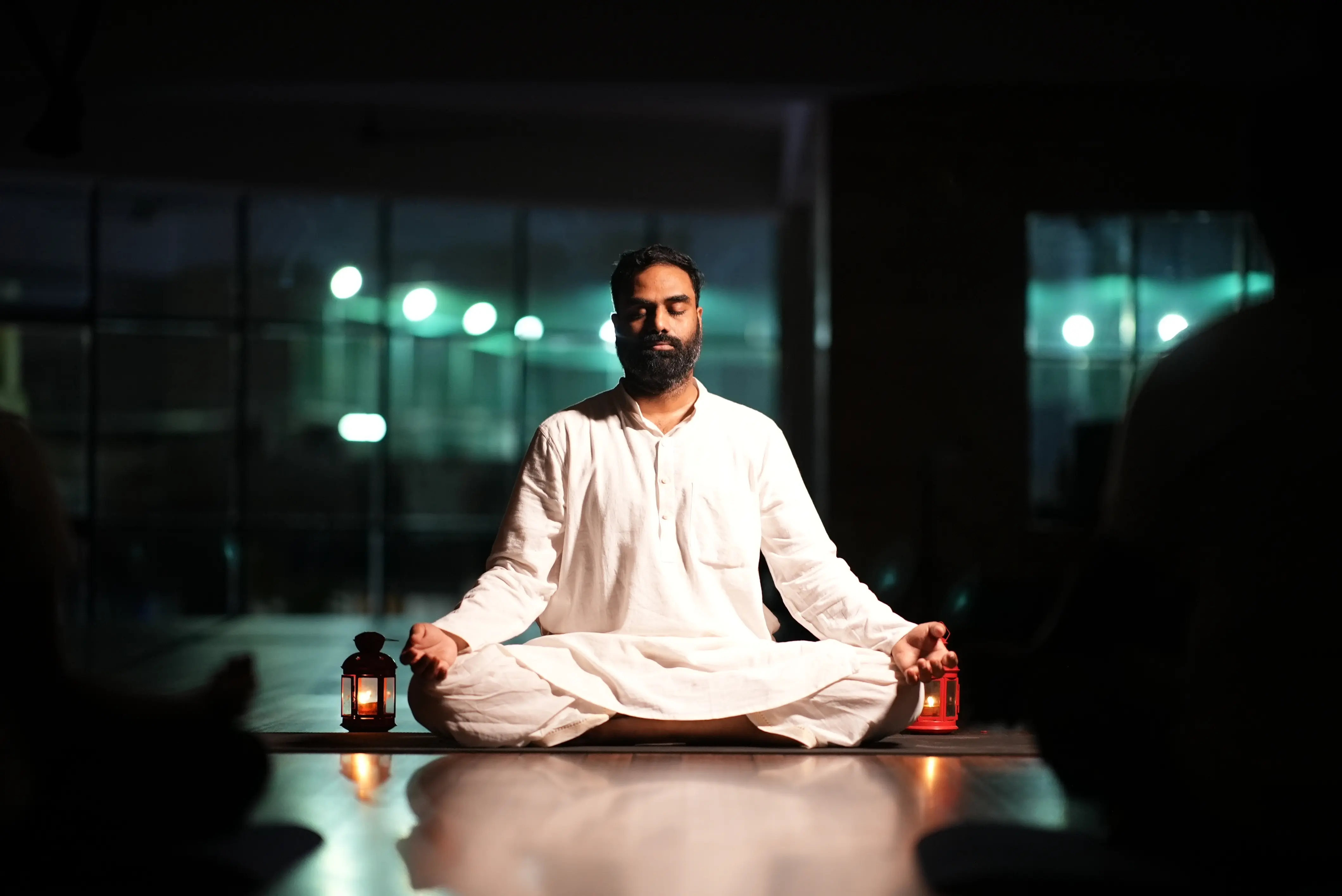 Navyoga Teacher Training — Naveen meditating with candles